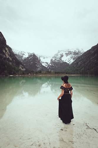 clothing woman standing on calm body of water apparel